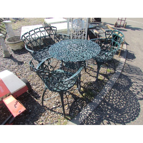 1049 - A 20th Century cast aluminium patio set in the Victorian style, comprising a circular two-tier table... 