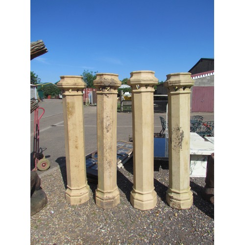 1050 - A pair of modern terracotta exceptionally tall octagonal chimney pots, with heart-motif cut-outs to ... 