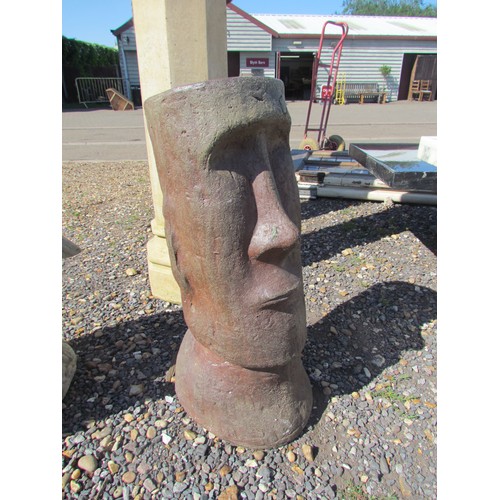 1053 - A modern terracotta garden planter in the form of an Easter Island head. Height 70cm