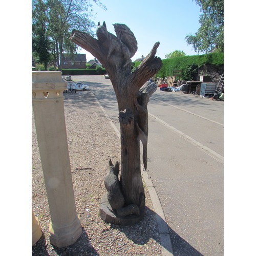 1056 - An Andy Barton tree trunk chainsaw carving with fox, pine marten and squirrel. Labelled at base. In ... 