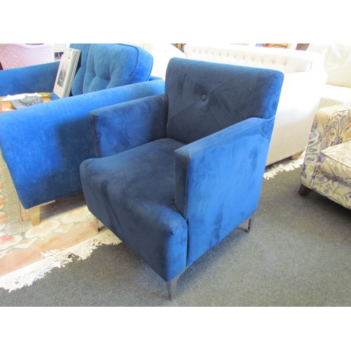 1060 - A modern blue upholstered armchair on chrome effect feet.