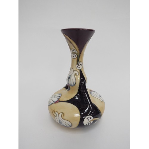 6640 - A Moorcroft pottery vase decorated in the Prophecy pattern, designed by Sian Leeper, c2007, of twin ... 