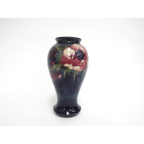 6650 - A Moorcroft Anemone pattern vase, 18cm tall