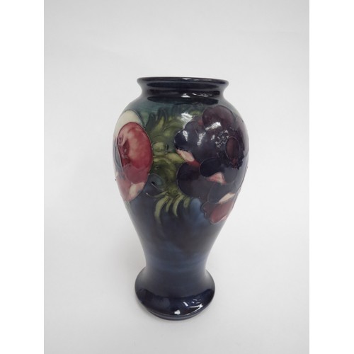 6650 - A Moorcroft Anemone pattern vase, 18cm tall