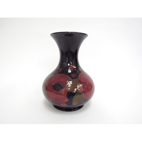 6649 - A William Moorcroft Pomegranate pattern vase, 19.5cm tall