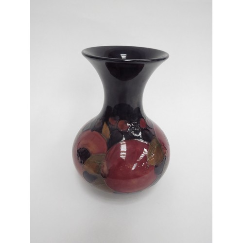 6649 - A William Moorcroft Pomegranate pattern vase, 19.5cm tall