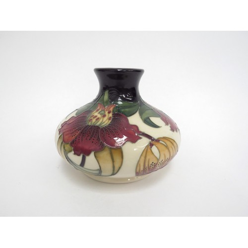 6655 - A Moorcroft Anna Lily pattern squat form vase designed by Nicola Slaney, 11cm tall