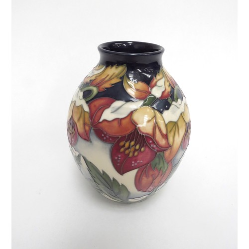 6654 - A Moorcroft Christmas Hellebore pattern vase, designed by Rachel Bishop, 13cm tall