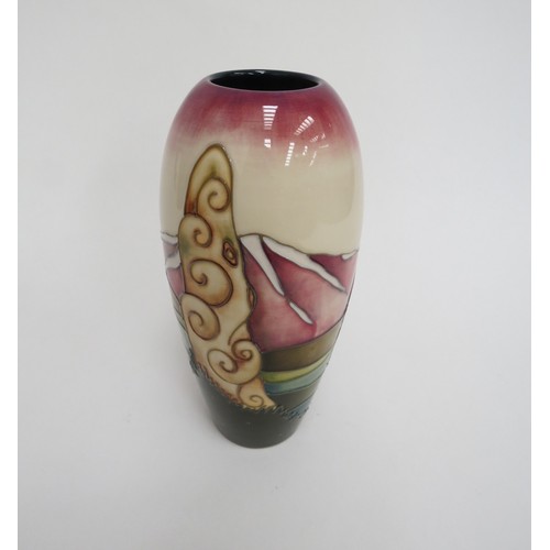 6617 - A Moorcroft Collectors Club vase depicting a black bird on stylised rocks, dated '99, 19cm tall