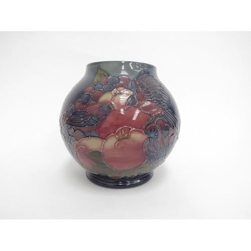 6618 - A Moorcroft Finches and Berries pattern vase, monogrammed WM to base, 17cm tall