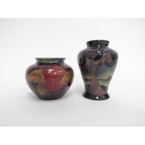 6630 - Two pieces of Moorcroft including a small Pomegranate vase, 7cm tall and a Western Isles pattern vas... 