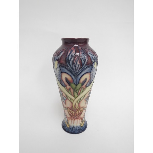 6625 - A Moorcroft vase decorated with blue irises and small blue flowers, monogrammed WM to base, second, ... 