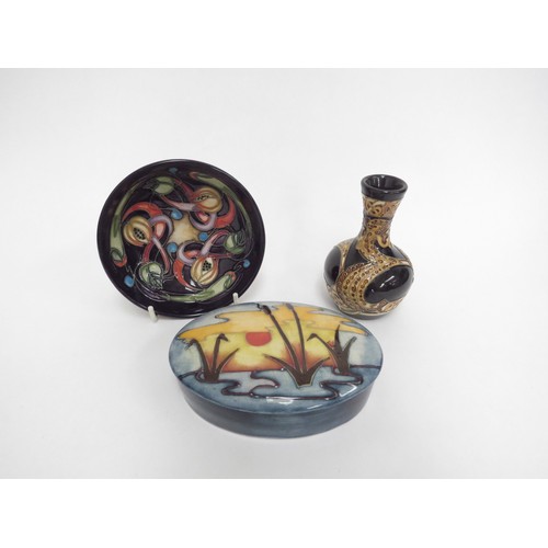 6634 - Three pieces of Moorcroft including Land Horse pattern vase, 10cm tall, Reeds at Sunset pattern oval... 