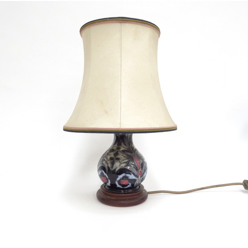 6610 - A Moorcroft Snakeshead pattern table lamp base, 25cm tall including fitment