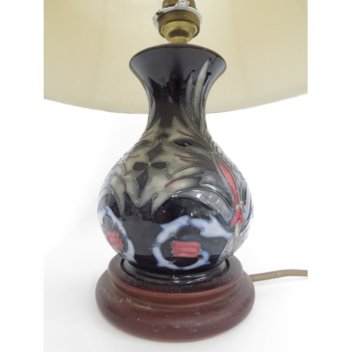 6610 - A Moorcroft Snakeshead pattern table lamp base, 25cm tall including fitment