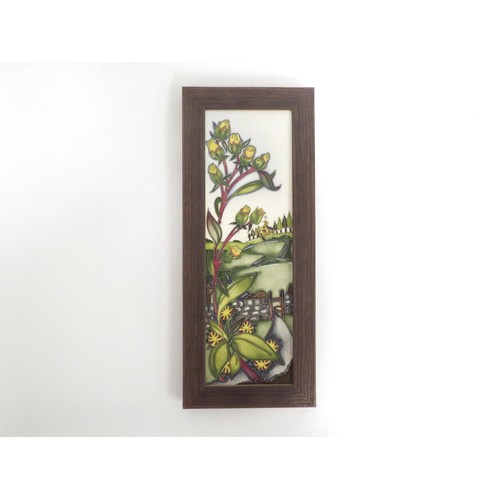 6635 - A Moorcroft plaque designed by Nicola Slaney depicting a stile in dry stone wall with Church to yond... 