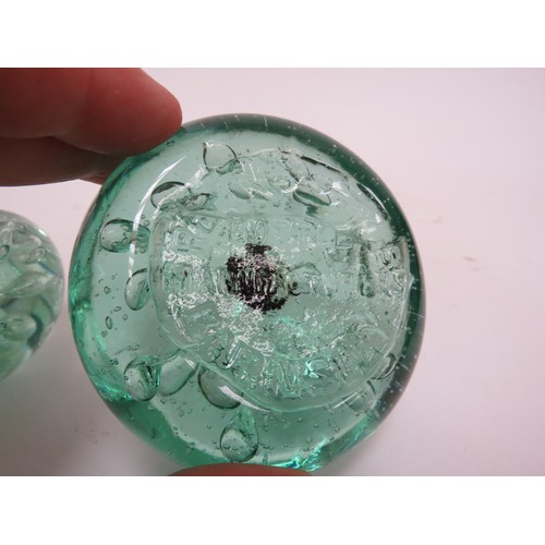 6608 - Two flat bubble glass advertising paperweights, 