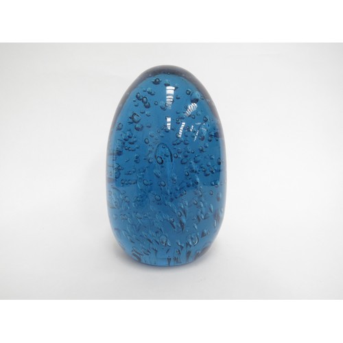 6604 - A large blue dump glass doorstop with bubble inclusions, 19cm tall