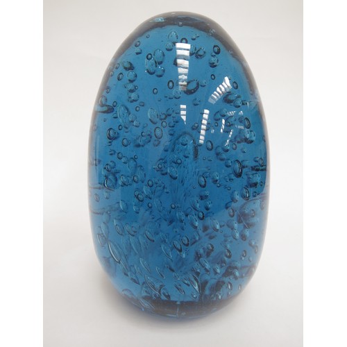 6604 - A large blue dump glass doorstop with bubble inclusions, 19cm tall