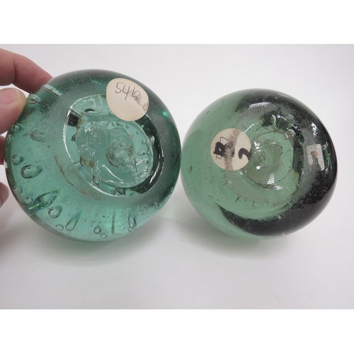 6593 - Two Victorian green glass dumps one with enclosed plaster figure the other with figure and bubble in... 