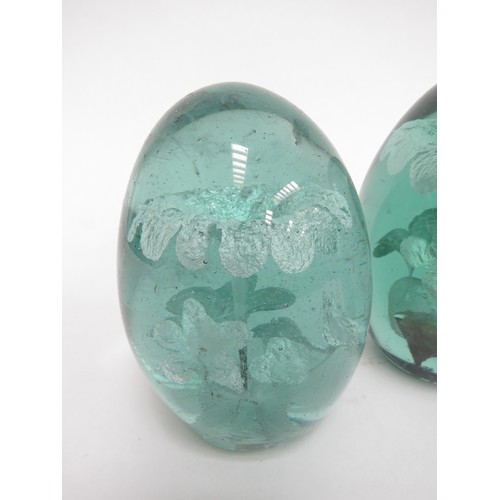 6589 - Three Victorian green glass dumps with foil flower inclusions, tallest 12cm