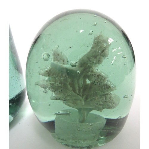 6586 - Two Victorian green glass dumps with plaster inclusions of Scottish Thistle, tallest 11cm