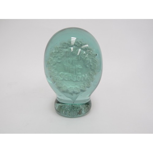 6596 - A large Victorian green glass dump with a plaster plaque inclusion 