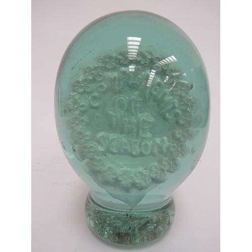 6596 - A large Victorian green glass dump with a plaster plaque inclusion 