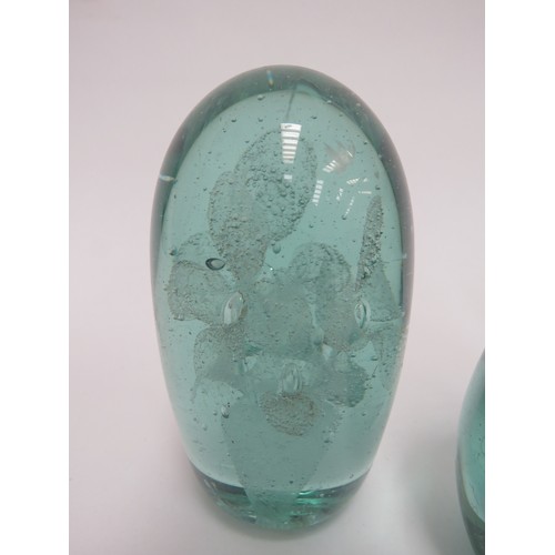 6581 - Three Victorian green glass dumps all with flower bouquet inclusions, tallest 11cm