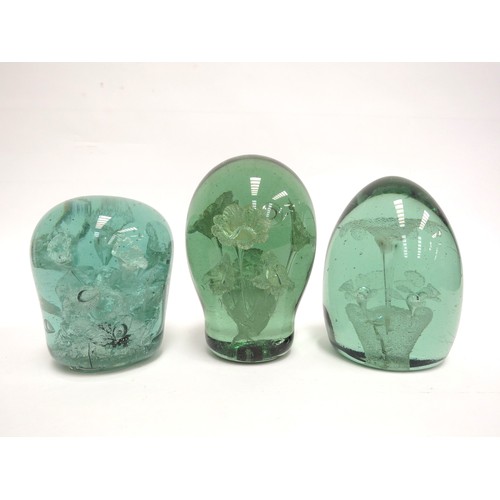 6584 - Three Victorian green glass dumps all with floral inclusions, tallest 13cm