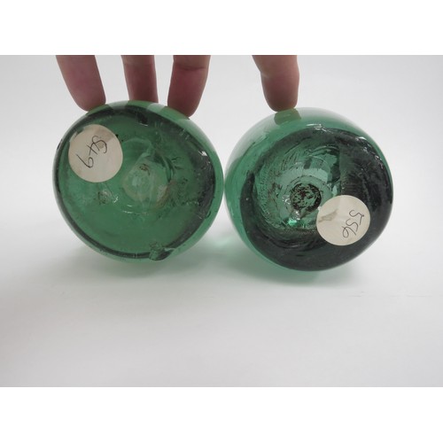 6582 - Two Victorian green glass dumps both with floral inclusions, tallest 15cm