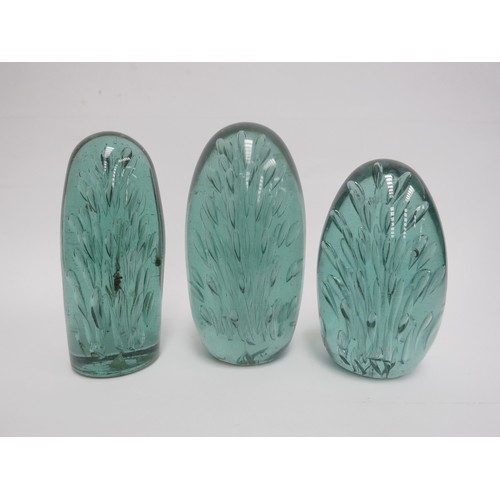 6571 - Three Victorian green glass dumps of elongated form all with bubble inclusions, tallest 18cm