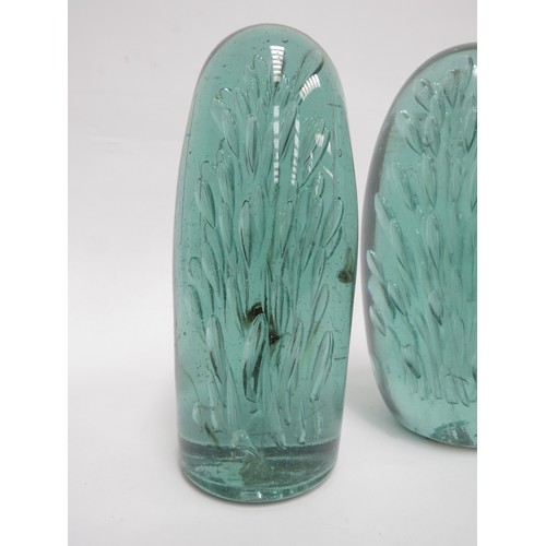 6571 - Three Victorian green glass dumps of elongated form all with bubble inclusions, tallest 18cm