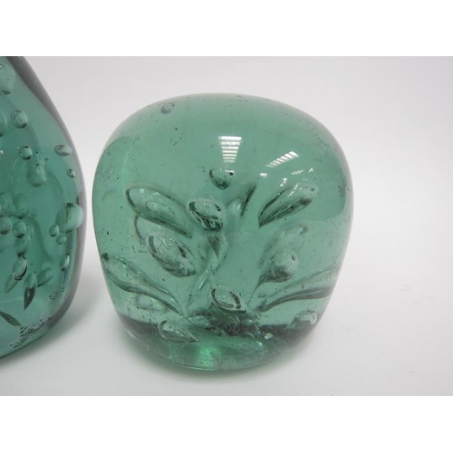 6576 - Two Victorian green glass dumps both with bubble inclusions, tallest 12cm