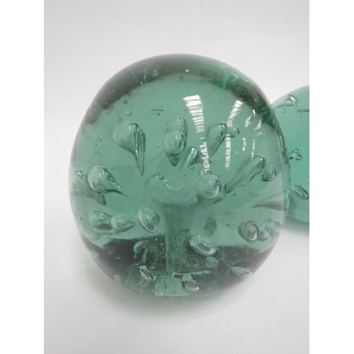 6574 - Two circular green glass dumps with bubble inclusions, tallest 12cm