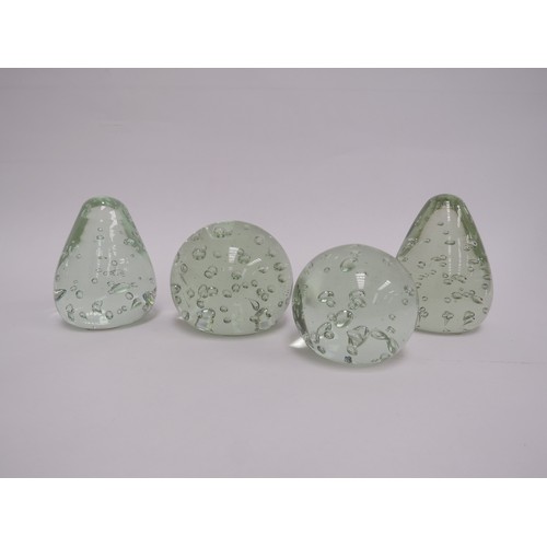 6573 - Four pale green glass dumps with bubble inclusions, tallest 9.5cm