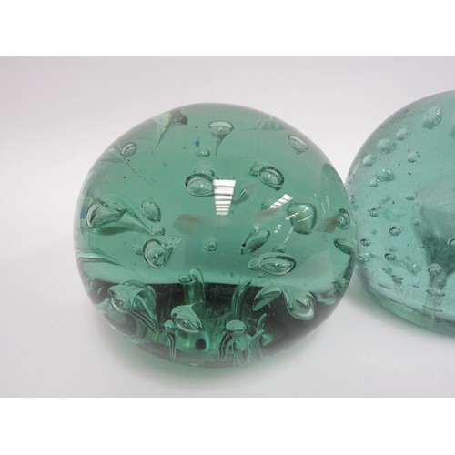 6570 - Three large Victorian green glass dumps with bubble inclusions, 11.5cm tallest