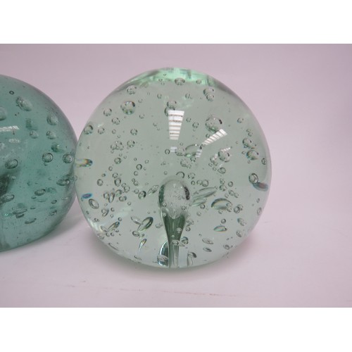 6570 - Three large Victorian green glass dumps with bubble inclusions, 11.5cm tallest