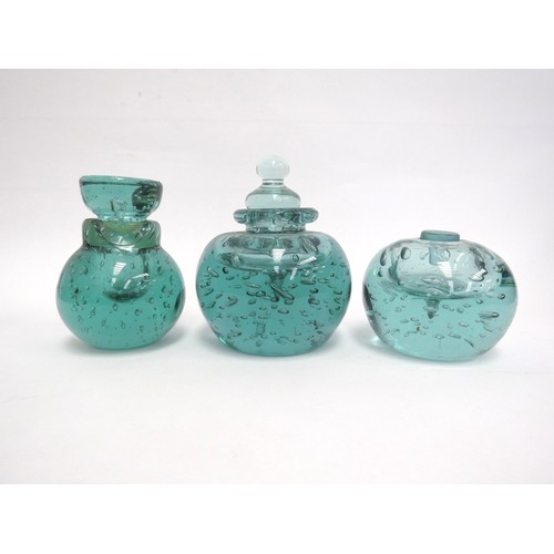 6568 - Three Victorian green dump glass inkwells all with bubble inclusions, (one with stuck stopper and da... 