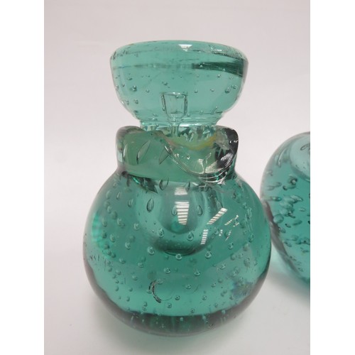 6568 - Three Victorian green dump glass inkwells all with bubble inclusions, (one with stuck stopper and da... 