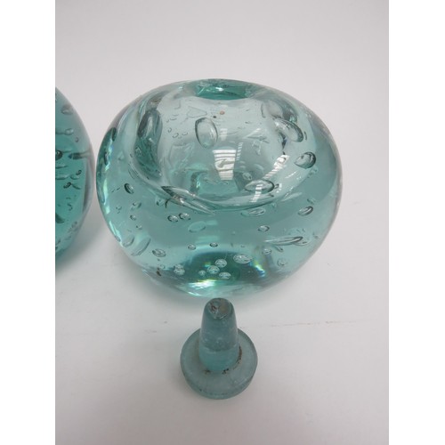 6568 - Three Victorian green dump glass inkwells all with bubble inclusions, (one with stuck stopper and da... 