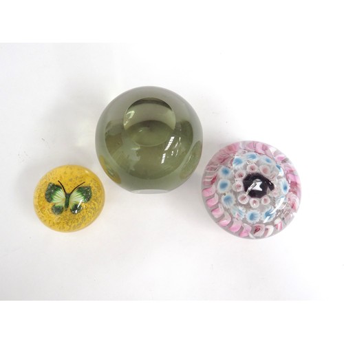 6715 - Three paperweights including yellow with green butterfly, pale yellow glass and another (3)