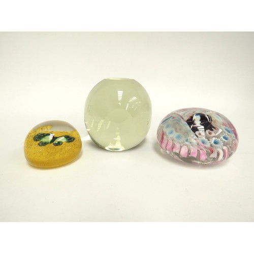 6715 - Three paperweights including yellow with green butterfly, pale yellow glass and another (3)