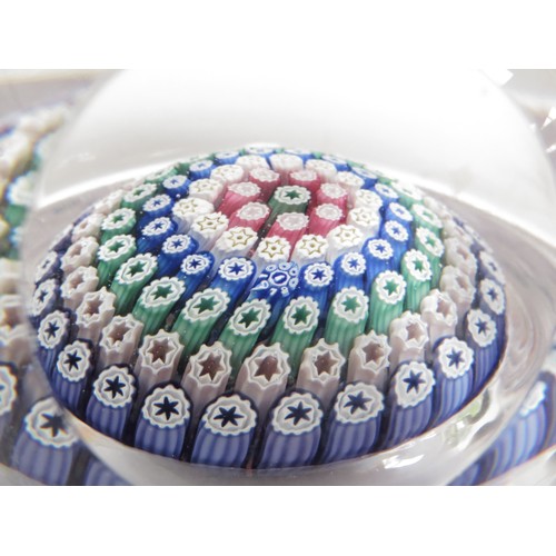 6708 - A Whitefriars millefiori cane paperweight and two smaller examples (3)