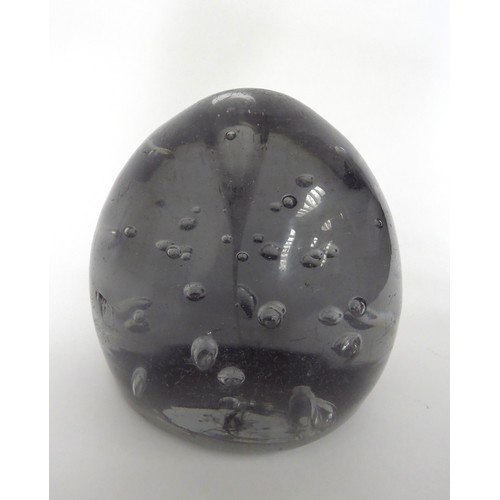 6603 - A Victorian grey glass dump with bubble inclusions, 13cm tall