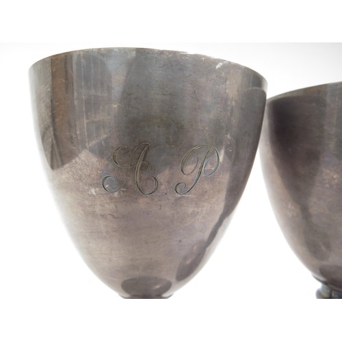 6686 - A pair of Garrard and Co Ltd silver goblets, hallmarked for 1977, London. Monogram to bowls. 15cm hi... 