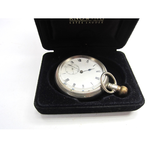 4421 - A nickel plated pocket watch with white enamel dial, set with Roman numerals and subsidiary seconds.... 