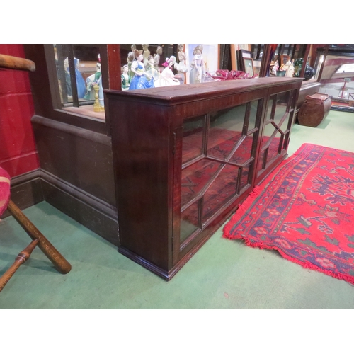 4214 - A George III mahogany table-top astragal glazed two door cabinet, crack to one pane, 53cm tall x 140... 