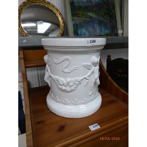 3591 - A white glazed terracotta plant pot with cherubs