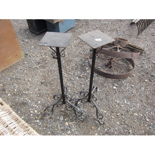 3553 - A pair of metal adjustable pot stands